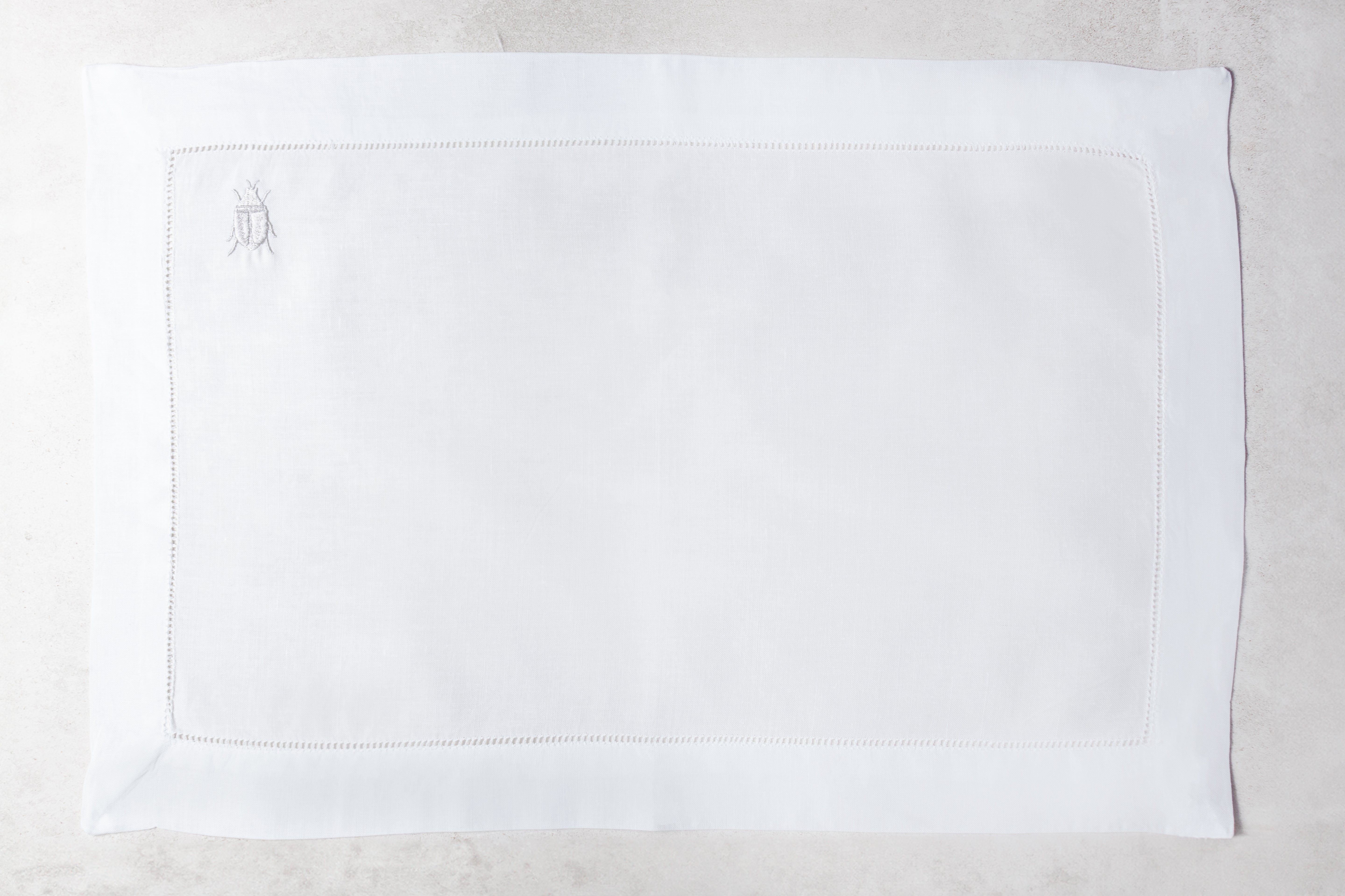 Mantel individual de lino